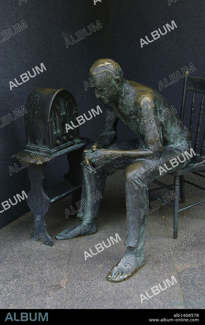 Franklin Delano Roosevelt Memorial. Bronze statue that depicts the Great Depression. Man listening to a fireside chat on the radio. Washington D.C. United States.