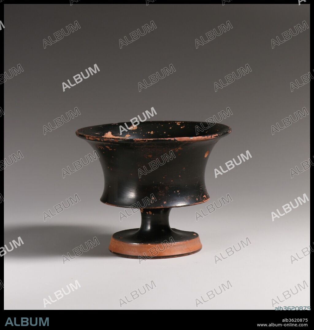 Terracotta stemmed dish. Culture: Greek, Attic. Dimensions: H. 3 1/4 in. (8.3 cm). Date: late 5th century B.C..
This is one of a variety of shapes that probably contained food--olives, small fruits, nuts--rather than liquids.