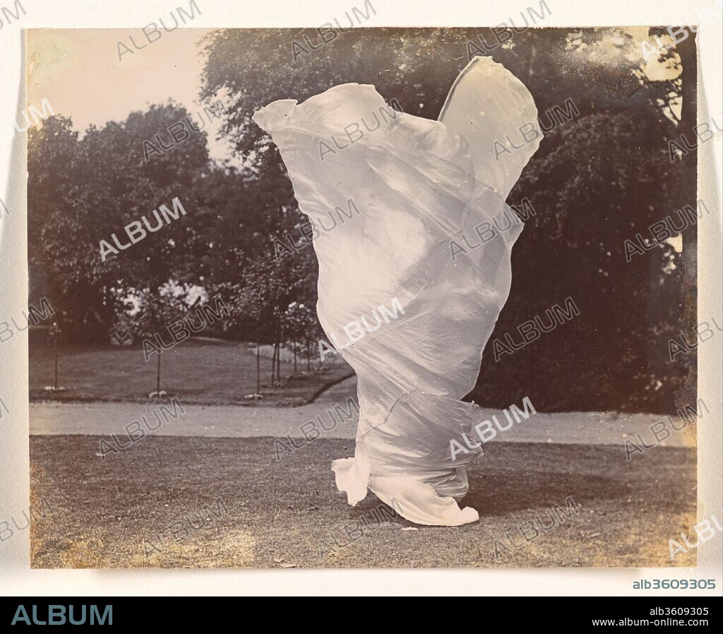 [Loie Fuller Dancing]. Artist: Samuel Joshua Beckett (British, Shadwell, Stepney [London] 1870-1940 Bournemouth). Dimensions: 10.1 x 12.5 cm (4 x 4 15/16 in.). Date: ca. 1900.
The American dancer Loie Fuller (1862-1928) conquered Paris on her opening night at the Folies-Bergère on November 5, 1892. Manipulating with bamboo sticks an immense skirt made of over a hundred yards of translucent, iridescent silk, the dancer evoked organic forms --butterflies, flowers, and flames--in perpetual metamorphosis through a play of colored lights. Loie Fuller's innovative lighting effects, some of which she patented, transformed her dances into enthralling syntheses of movement, color, and music, in which the dancer herself all but vanished. Artists and writers of the 1890s praised her art as an aesthetic breakthrough, and the Symbolist poet Stéphane Mallarmé, who saw her perform in 1893, wrote in his essay on her that her dance was "the theatrical form of poetry par excellence."  Immensely popular, she had her own theater at the 1900 Exposition Universelle in Paris, promoted other women dancers including Isadora Duncan, directed experimental movies, and stopped performing only in 1925.
 Loie Fuller's whirling, undulating silhouette, which embodied the fluid lines of Art Nouveau, inspired many images, from the portraits of Toulouse-Lautrec and the posters of Jules Chéret and Alphonse Mucha to the sculptures of Pierre Roche and Théodore Rivière, as well as the photographs of Harry C. Ellis and Eugène Druet. The three pictures shown here depict movements from such dances as "Dance of the Lily" and "Dance of Flame." These images do not pretend to evoke the otherworldly effect of the performance, which took place on a darkened stage in front of a complex set of mirrors and whose magic was entirely dependent on lighting. Here, the strange shapes, reminiscent of chalices and butterflies, take form, incongruously, in the middle of an urban park, through the efforts of a short, stout figure. Arrested in crude natural light, they still retain, however, their spellbinding energy. Part of a group of thirteen photographs complemented by six others in the Musée d'Orsay, Paris, these images belonged to the sculptor Théodore Rivière (1857-1912), and were previously thought to have been made by him. They have now been reattributed to Samuel Joshua Beckett, a photographer working in London.