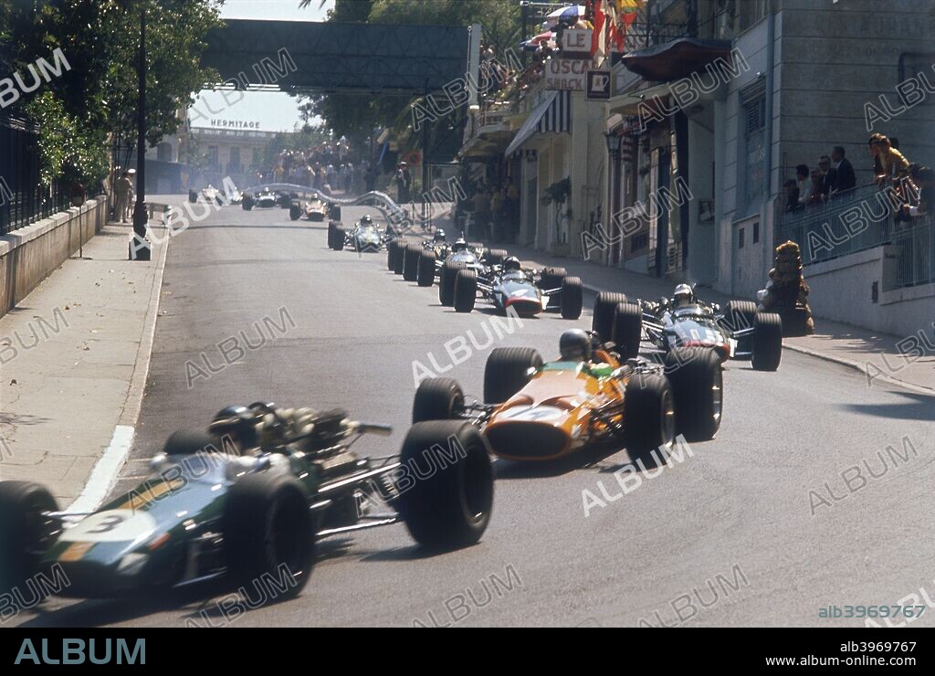 Action from the Monaco Grand Prix, 1968. Jochen Rindt's Brabham-Repco enters a corner ahead of Bruce McLaren's McLaren-Ford. Both drivers crashed out of the race, McLaren on the opening lap and Rindt eight laps later. The race was won by Graham Hill in a Lotus.