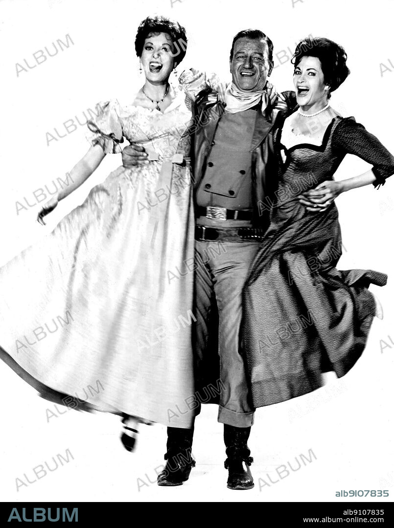 JOHN WAYNE, MAUREEN O'HARA and YVONNE DE CARLO in MCLINTOCK!, 1963, directed by ANDREW V. MCLAGLEN. Copyright UNITED ARTISTS.