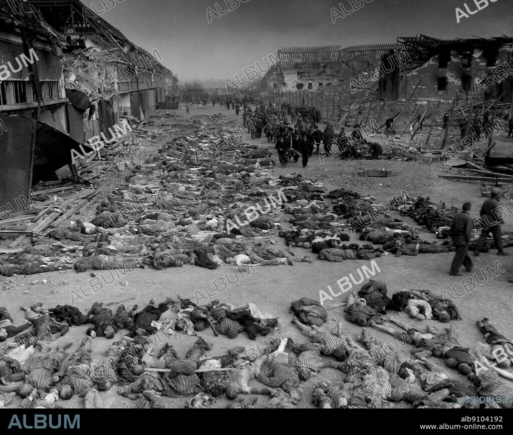 WW2: German atrocities. Rows of dead inmates fill the yard at Lager Nordhausen, a Gestapo concentration camp near Nordhausen, Germany. They dies of starvation and from Gestapo bullets. This concentration camp had 3000-4000 inmates, including French, Polish, Belgian, Russian and several German prisoners. All of them were maltreated, beaten and starved. 12th April 1945.