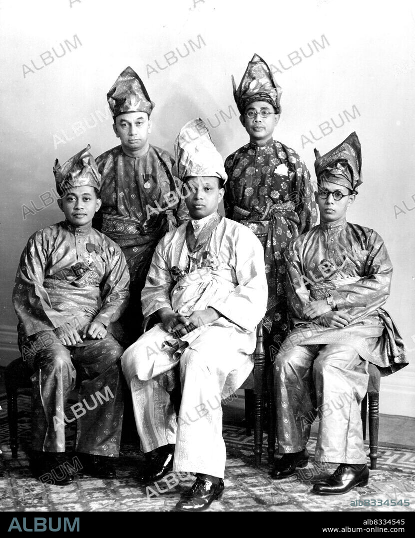The Sultan Of Pahang Surrounded By His Bodyguard --  New study of The Sultan of Pahang surrounded by the four members of his bodyguard.The sultan is the representative from the Federated Malay States, and is here seen in the robes he will wear at the Coronation of King George VI in Westminster Abbey on May 12th.He visited England some years ago as Crown Prince. May 31,1937.