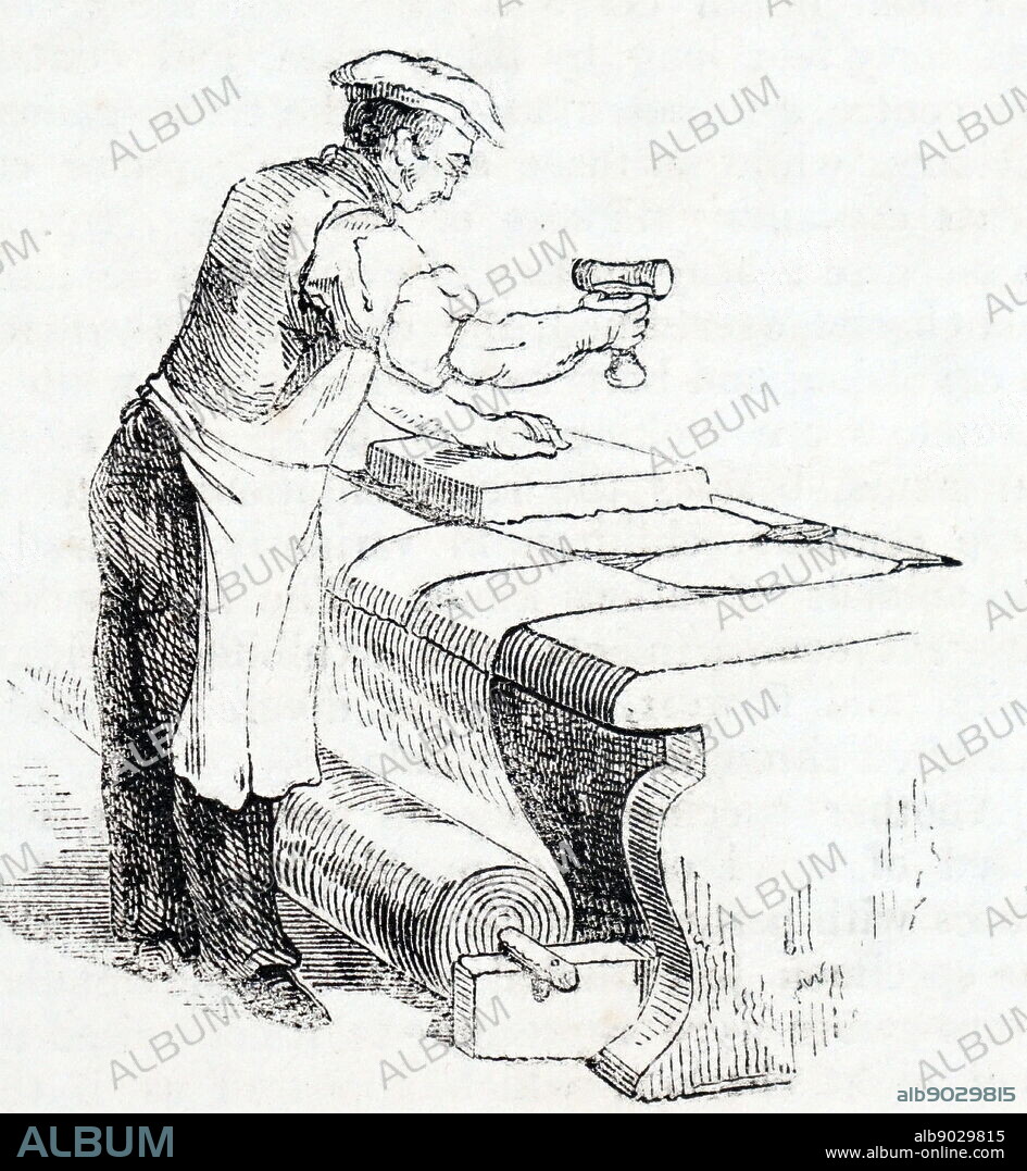 Illustration showing Hand-block printing floor-cloth. The man is working one a roll of canvas, which has already been trowel painted. He is applying the pattern using paint covered blocks. 1842.