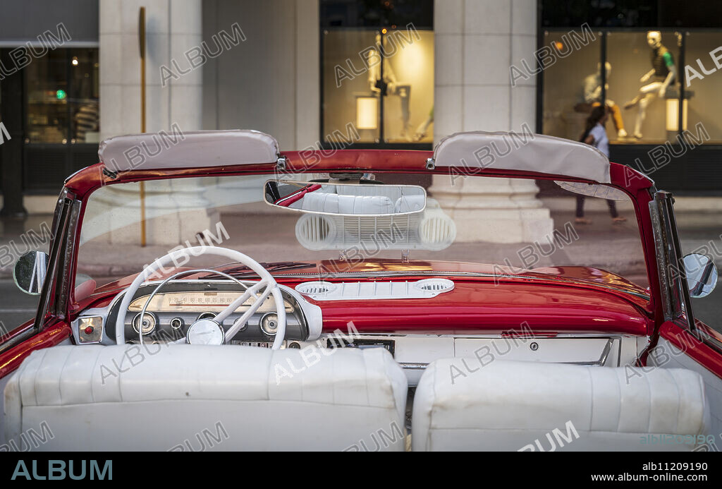 Vintage American taxi car interior, Havana at dusk, La Habana, Cuba, West Indies, Caribbean, Central America.