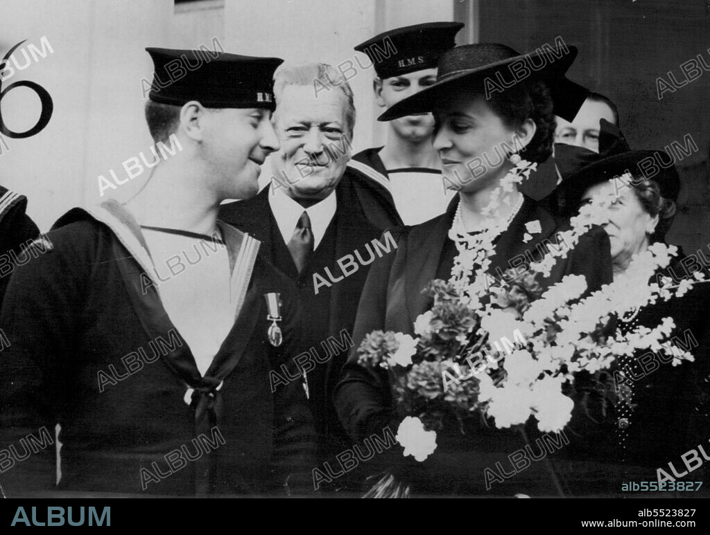 The Duchess of Kent Opens Newfoundland Caribou Club For The Newfoundland Forces In London -- The Duchess of Kent in conversation outside the Club, after the opening ceremony, with Leading Seaman Marmaduke Winston Spencer Churchill Snow of Middletown Junction, Newfoundland who was awarded the D.S.M. for his gallantry at Tobruk at a recent Investiture. July 22, 1943.