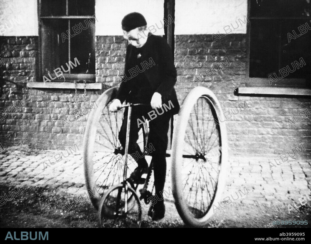 Johnny Dunlop, aged about ten, riding his tricycle with rubber tyres, 1888. His father, John Dunlop, was the inventor of the pneumatic rubber tyre. He was inspired by his son's complaints that solid wheels jarred him, and so produced 'air-cushion' hosepipe tyres.