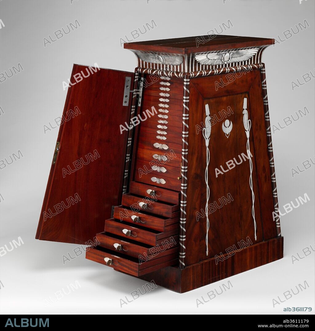 Coin cabinet. Culture: French, Paris. Decorator: Decoration after drawings by baron Dominique Vivant Denon (French, Givry 1747-1825 Paris). Designer: Designed by Charles Percier (French, Paris 1764-1838 Paris). Dimensions: Overall: 35 1/2 × 19 3/4 × 14 3/4 in. (90.2 × 50.2 × 37.5 cm). Maker: Probably by François-Honoré-Georges Jacob-Desmalter (French, 1770-1841); Silver mounts by Martin-Guillaume Biennais (French, 1764-1843, active ca. 1796-1819). Date: ca. 1809-19.
The design, medium, and execution of this extravagant medal cabinet are as impressive and eccentric as the man who probably commissioned it, Napoleon, Emperor of the French (1769-1821), who at the time of its making was a step away from abdication and exile.[1]  The first significant contemporary reference to it has been published by Antony Griffiths: "The most interesting record, however, is an account submitted in February 1814 by [the goldsmith] Biennais for 3600 francs, for what is described as the 'médailler du Roi.'" In Biennais's account, Griffiths continues, this medal cabinet for the king is described as "in the form of an Egyptian pedestal, containing 44 mahogany drawers with silver mounts, and meant to serve as a stand for the emperor's old medal cabinet."[2]
Napoleon was interested in medals. While campaigning in Egypt in the 1790s, he found a medal of the Roman general Julius Caesar, and in 1803 when he was considering an invasion of England, some coins of William the Conqueror were uncovered at Ambleteuse. Both discoveries were considered extremely propitious.[3] He developed the practice of distributing medals on state occasions to commemorate the high points of his career, and he also had special editions struck in precious metals and sent to foreign allies. The first fully documented owner of this cabinet, Napoleon's Director General of Museums, Baron Dominique-Vivant Denon, was no less an enthusiast. When his estate was sold after his death, three thousand contemporary medals alone were listed in the inventory.[4] Denon had accompanied Napoleon on his Egyptian campaign in 1798-99 as a recording draftsman. The book he wrote based on his experiences and observations along the Nile, Voyage dans la Basse et la Haute Égypte (1802), brought ancient Egypt to life for his readers and whipped up to a frenzy the European craze known as Egyptomania. Napoleon later appointed Denon director of the Musée Napoléon (now the Musée du Louvre). He was also for a time in charge of the medals mint (Monnaie des Médailles) and designed the ceremonial necklace of the Legion of Honor, a special badge with a chain, made by the French firm of Biennais, which Napoleon gave to distinguished members of his immediate entourage.[5]
Denon may have instructed the designer Charles Percier regarding the details of this splendid cabinet.[6] The pylon (gateway) at Apollonopolis Parva (now Ghoos) in Upper Egypt, which Denon recorded in his book, served as the inspiration for the top section.[7] The piece was made by the Parisian firm of François-Honoré-Georges Jacob-Desmalter, who in 1807 employed as many as 350 specialist craftsmen. His furniture is characterized by superb quality, classical severity, and functional perfection. Whether or not the cabinet was commissioned by Napoleon, it would have appealed to him. The emperor once compared his own perfectly orderly mind to "a chest of drawers, which he could open or close at will, forgetting any subject when its drawer was closed, and  finding it ready with all necessary detail when its drawer was opened."[8]
Like other grand furniture of the Empire period, the cabinet is decorated with applied and inlaid metal, but here the patron demanded something out of the ordinary: the fittings are of the finest silver (having a purity of 950/1,000) rather than the usual gilded bronze. The famous goldsmith's shop of Martin-Guillaume Biennais was selected to make them. Beneath the cornice at the top there are inlaid silver bands surmounted by an Egyptianizing winged disk and two uraei, the sacred cobra symbol of ancient Egyptian kings. Inlaid on the front and the back panel of the cabinet is a winged scarab between uraei astride lotus stalks. The eye of each uraeus is a catch; when a silver stick that accompanies the keys to the cabinet is inserted in the pupil, the body of the snake falls forward to reveal the keyhole that opens one of the two side doors. Then the function of the cabinet is revealed. Each cupboard contains twenty-two drawers of graduated size, formerly fitted to hold medals and coins (the number of each drawer is engraved on an octagonal silver plaque affixed to the top edge). In the center of each drawer front is inlaid a silver scarablike insect, whose right wing is hinged to provide a pull. In addition to his maker's mark on one wing of each winged disk, Biennais had his name engraved above each keyhole so that no one opening the cupboards could miss it.
As Jean-Marcel Humbert has observed, "The originality and variety of its decoration make this piece an excellent illustration of the taste for things Egyptian at the beginning of the nineteenth century. At the same time, it is the very essence of Egyptomania: the adaptation of antique forms and decorations, in dimensions as well as materials, to a type of object and function completely different from those associated with these symbols in Antiquity."[9]
[Wolfram Koeppe 2006]
Footnotes:
[1] On the design, medium, and execution of the cabinet, see Dominique-Vivant Denon: L'oeil de Napoléon. Exh. cat., Musée du Louvre. Paris, 1999, p. 425, no. 492 (entry by Anne Dion-Tenenbaum). For the silver marks, see Louis Carré. A Guide to Old French Plate. London, 1931, p. 202 (Paris mark for first-standard silver), p. 203 (Paris medium excise mark); Émile Beuque and Marcel Frapsauce. Dictionnaire des poinçons de maîtres-orfèvres français du XIVe siècle à 1838. Paris, 1929, p. 281, no. 2493; and Henry Nocq. Le poinçon de Paris: Répertoire des maîtres-orfèvres de la jurisdiction de Paris depuis le Moyen-Âge jusqu'à la fin de XVIIIe siècle. 5 vols. Paris, 1926-31, p. 195 (standard marks described, dated 1797). Other recent literature on the cabinet includes the following: Napoléon. Exh. cat., Grand Palais, Paris, 1969, pp. 105-6, no. 289 (entry by Serge Grandjean); The Age of Neo-Classicism. Exh. cat., Royal Academy of Arts and Victoria and Albert Museum. London, 1972, no. 1609 (entry by William Rieder); Pierre Kjellberg. Le mobilier français. Vol. I, Du Moye Âge à Louis XV. Vol. 2, De la transition Louis XV-XVI à 1925. Paris, 1978-80, vol. 2, p. 151,  fig. 143; Wolfram Koeppe. "Quo Vadis Möbelliteratur?" Kunst & Antiquitäten, 1993, no. 9, p. 43; Pierre Arizzoli-Clémental. "Néoclassicisme." In L'art décoratif en Europe, ed. Alain Gruber, vol. 3, Du Néoclassicisme à l'Art Déco, pp. 21-127. Paris, 1994, p. 67; and Michael Pantazzi. "Italy and the Grand Tour." In Jean-Marcel Humbert, Michael Pantazzi, and Christine Ziegler. Egyptomania: Egypt in Western Art, 1730-1930. Exh. cat. Musée du Louvre, Paris; National Gallery of Canada, Ottawa; and Kunsthistorisches Museum, Vienna. Ottawa and Paris, 1994, pp. 206-8, no. 107 (entry by Jean-Marcel Humbert).
[2] "en forme de piédestal égyptien, contenant 44 tiroirs en bois d'acajou avec ornemens incrustés en argent, et destiné à supporter l'ancien médaillier de l'Émpereur." Antony Griffiths. "The End of Napoleon's Histoire Métallique." Medal, no. 18 (Spring 1991), pp. 47-49,  fig. 17.
[3] James David Draper, with Clare Le Corbeiller. The Arts under Napoleon: An Exhibition of the Department of European Sculpture and Decorative Arts, with Loans from the Audrey B. Love Foundation and Other New York Collections. Exh. cat., The Metropolitan Museum of Art. New York, 1978, no. 14,  fig. 5.
[4] L. J. J. Dubois. Description des objets d'arts qui composent le cabinet de feu M. le baron V. Denon: Monuments antiques, historiques, modernes; ouvrages orientaux, etc. Paris, 1826, p. 191, no. 835; and Dominique-Vivant Denon: L'oeil de Napoléon. Exh. cat., Musée du Louvre. Paris, 1999.
[5] Anne Dion-Tenenbaum. L'orfèvre de Napoléon: Martin-Guillaume Biennais. Exh. cat., Musée du Louvre. Les dossiers due Musée du Louvre. Paris, 2003, pp. 102-4, no. 67.
[6] On Percier as the designer of this cabinet, see Michael Pantazzi. "Italy and the Grand Tour." In Jean-Marcel Humbert, Michael Pantazzi, and Christine Ziegler. Egyptomania: Egypt in Western Art, 1730-1930. Exh. cat. Musée du Louvre, Paris; National Gallery of Canada, Ottawa; and Kunsthistorisches Museum, Vienna. Ottawa and Paris, 1994, pp. 206-8, no. 107 (entry by Jean-Marcel Humbert). For other aspects of his career, see the catalogue entry for acc. no. 26.256.1.
[7] Dominique-Vivant Denon. Voyage dans la Basse et la Haute Égypte pendant les campagnes du Géneral Bonaparte. 2 vols. Paris, 1802. New ed.: Ed. Jean-Claude Watin. Paris, 1989-90, vol. 2, pl. LXXX,  fig. 1; and Pierre Kjellberg. Le mobilier français. Vol. I, Du Moye Âge à Louis XV. Vol. 2, De la transition Louis XV-XVI à 1925. Paris, 1978-80, vol. 2, p. 151,  fig. 143.
[8] Robert Roswell Palmer. A History of the Modern World. 2nd ed. Rev. with the collaboration of Joel Colton. New York, 1963, p. 370.
[9] Michael Pantazzi. "Italy and the Grand Tour." In Jean-Marcel Humbert, Michael Pantazzi, and Christine Ziegler. Egyptomania: Egypt in Western Art, 1730-1930. Exh. cat. Musée du Louvre, Paris; National Gallery of Canada, Ottawa; and Kunsthistorisches Museum, Vienna. Ottawa and Paris, 1994, pp. 206-8, no. 107 (entry by Jean-Marcel Humbert).