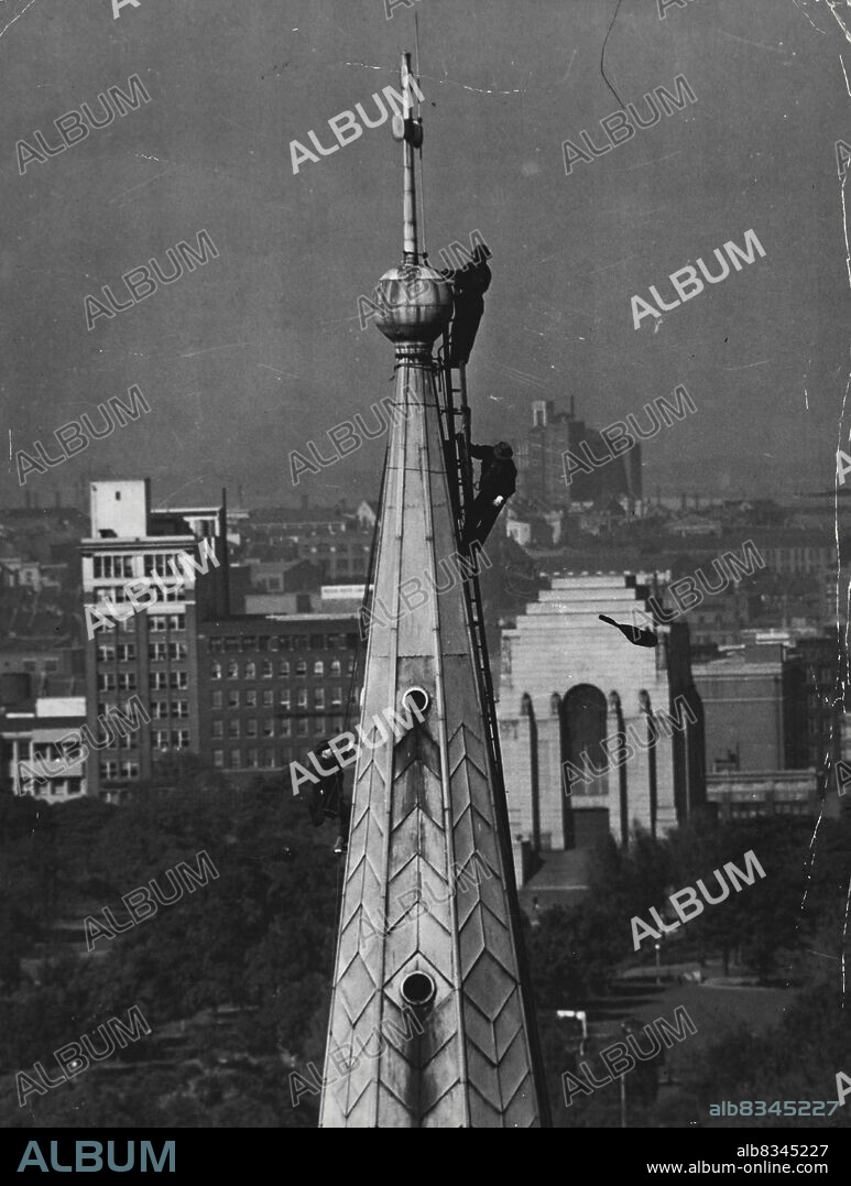 Charles and Sons Steelepjacks inspecting storm damage to the spire of St. James Church. Recent heavy ***** made extra work for Sydney steeple jacks. June 02, 1947.