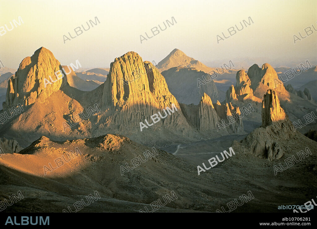 Ahaggar mountains (also known as the Hoggar mountains) in the highland region of the Sahara Desert, Algeria, at sunset.