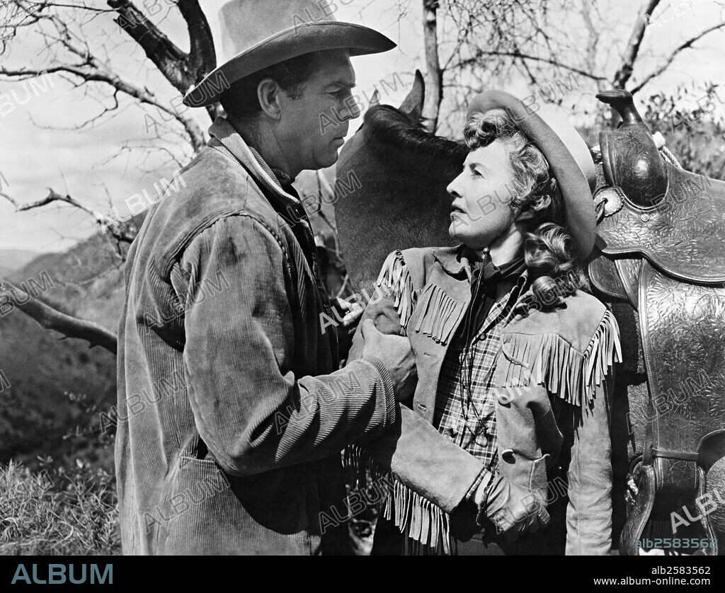 BARBARA STANWYCK and FRED MACMURRAY in THE MOONLIGHTER, 1953. Copyright WARNER BROTHERS.