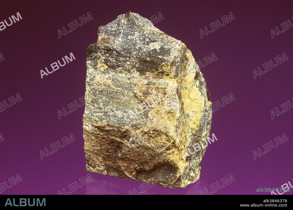 Lignite, a brown-colored coal with a high sulfur and moisture content. Specimen dimensions: 2 x 3 x 1.5 cm.