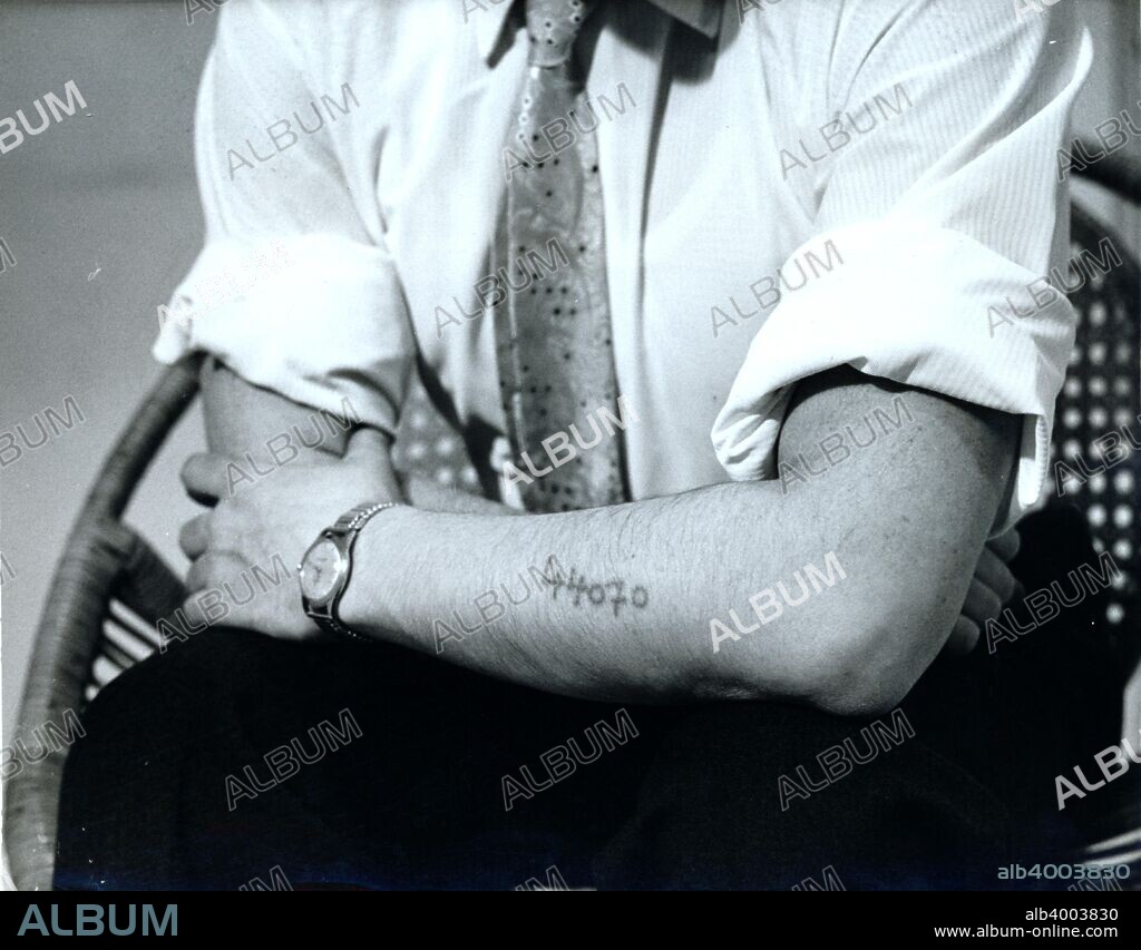 Dr Vrba displays his Auschwitz prison number, c1940s(?). Rudolf Vrba (1924-2006) was a Slovak Jew imprisoned in Auschwitz concentration camp in Poland. In April 1944 he and another prisoner, Alfred Wetzler, escaped and informed Slovak Jewish officials about the mass exterminations taking place at the camp, information that was then passed on to the Allies. Subsequent pressure from world leaders persuaded Hungarian regent Miklos Horthy to halt the mass deportation of his country's Jewish population to the Nazi extermination camps, although not before 475,000 had already been transported.