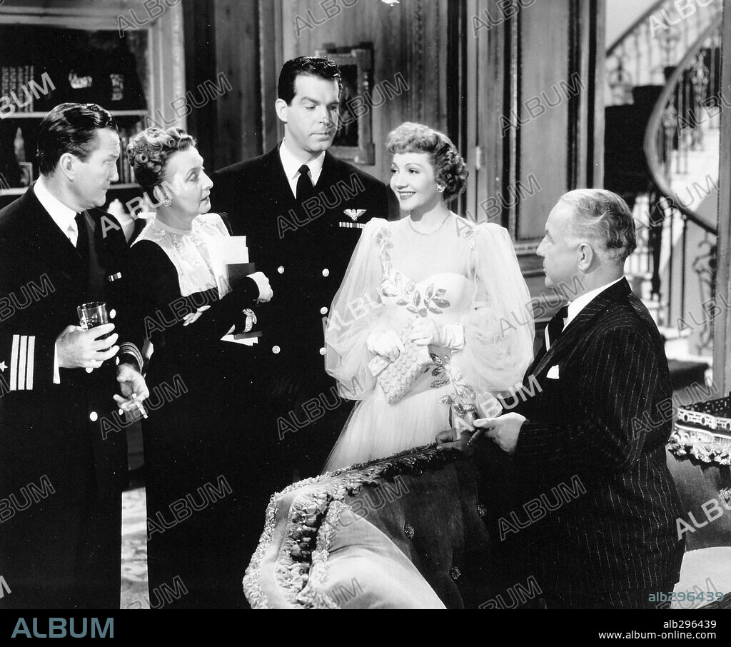 CLAUDETTE COLBERT and FRED MACMURRAY in PRACTICALLY YOURS, 1944, directed by MITCHELL LEISEN. Copyright PARAMOUNT PICTURES.