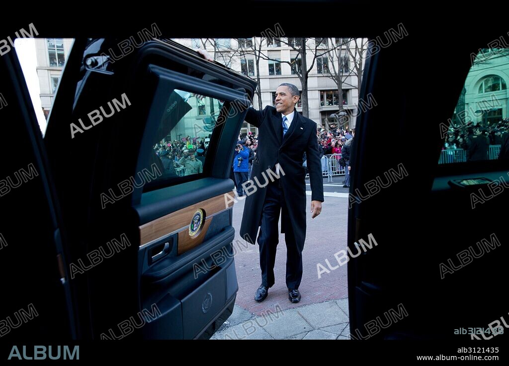 Photograph of President Barack Obama waving to watchers of the Presidential inaugural parade. Dated 2013.