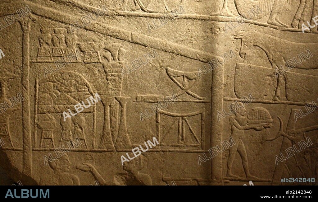 Tomb relief: Men harvesting in the presence of Hetepet (left) 6th dynasty 2360-2195 BC. (Photo by: Universal History Archive/UIG via Getty Images).