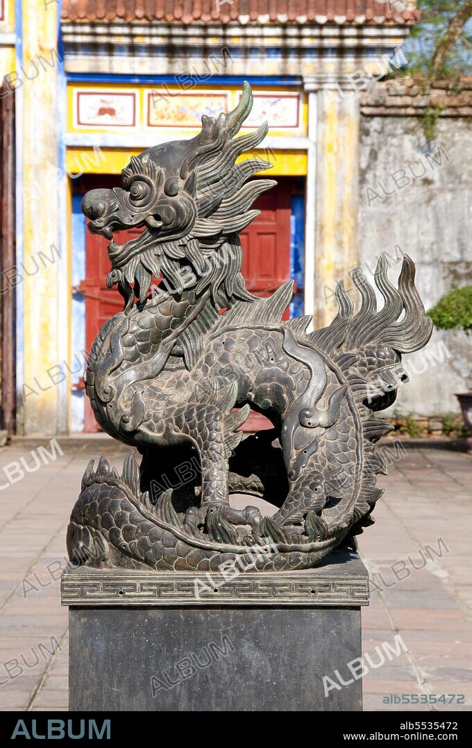 Emperor Gia Long ordered the construction of Hue Citadel in 1805. The vast complex is built according to the notions of fengshui or Chinese geomancy, but following the military principles of the noted 18th century French military architect Sebastien de Vauban. The result is an unusual and elegant hybrid, a Chinese-style Imperial City carefully aligned with surrounding hills, islands and waterways, but defended by massive brick walls between 6-12 metres high and 2.5 metres thick, punctuated by towers, ramparts, a massive earth glacis, and 24 Vauban-inspired bastions. The entire complex was further protected by wide moats, crossed by gracefully arched stone bridges leading to ten gates, the chief of which is Cua Ngo Mon, the south-east facing ‘Meridian Gate’. To compound the exotic hybrid effect, guard posts designed as Chinese-style miradors, complete with sweeping eaves crowned by imperial dragons, surmounted each gate. Finally, directly in front of the Ngo Mon Gate, a massive brick fort 18 metres high was constructed both as an additional barrier against malign spirits, and as a defensive redoubt. The area within the Citadel - in all, 520 hectares (1300 acres) - comprises three concentric enclosures, the Civic, Imperial and Forbidden Purple Cities. Access is by way of ten fortified gates, each of which is reached by a low, arched stone bridge across the moat. In imperial times a cannon would sound at 5am and 9pm to mark the opening and closing of the gates. Hue was the imperial capital of the Nguyen Dynasty between 1802 and 1945. The tombs of several emperors lie in and around the city and along the Perfume River. Hue is a UNESCO World Heritage Site.