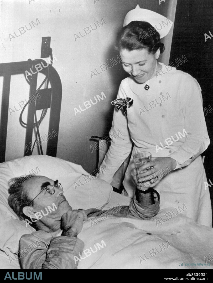 Tom Mooney in the Hospital - Tom Mooney, famous Labor Leader, shown being attended by Nurse Gladys Hogan at Passavant Hospital here. The 56-year-old Californian is being treated for hemorrhages of a gastric ulcer which caused him to cancel a coast-to-coast speaking tour last week. Mooney said his Ailmet was a recurrnce of an ulcer he suffered while serving more than twenty years of a life term in connection with the San Francisco preparedness day bombing in 1916. He is recovering. October 19, 1939. (Photo by Wide World Photo).