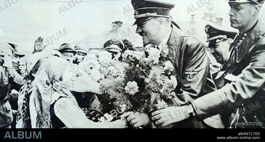 Adolf Hitler kissing a child in Marburg, photographed by Heinrich Hoffmann. Heinrich Hoffmann (12 September 1885 - 15 December 1957) was Adolf Hitler's official photographer, and a Nazi politician and publisher, who was a member of Hitler's intimate circle. Adolf Hitler (20 April 1889 - 30 April 1945) was an Austrian-born German politician who was the dictator of Germany from 1933 until his death in 1945. He rose to power as the leader of the Nazi Party, becoming the chancellor in 1933 and then assuming the title of Fuhrer und Reichskanzler in 1934. During his dictatorship, he initiated World War II in Europe by invading Poland on 1 September 1939. He was closely involved in military operations throughout the war and was central to the perpetration of the Holocaust, the genocide of about six million Jews and millions of other victims.