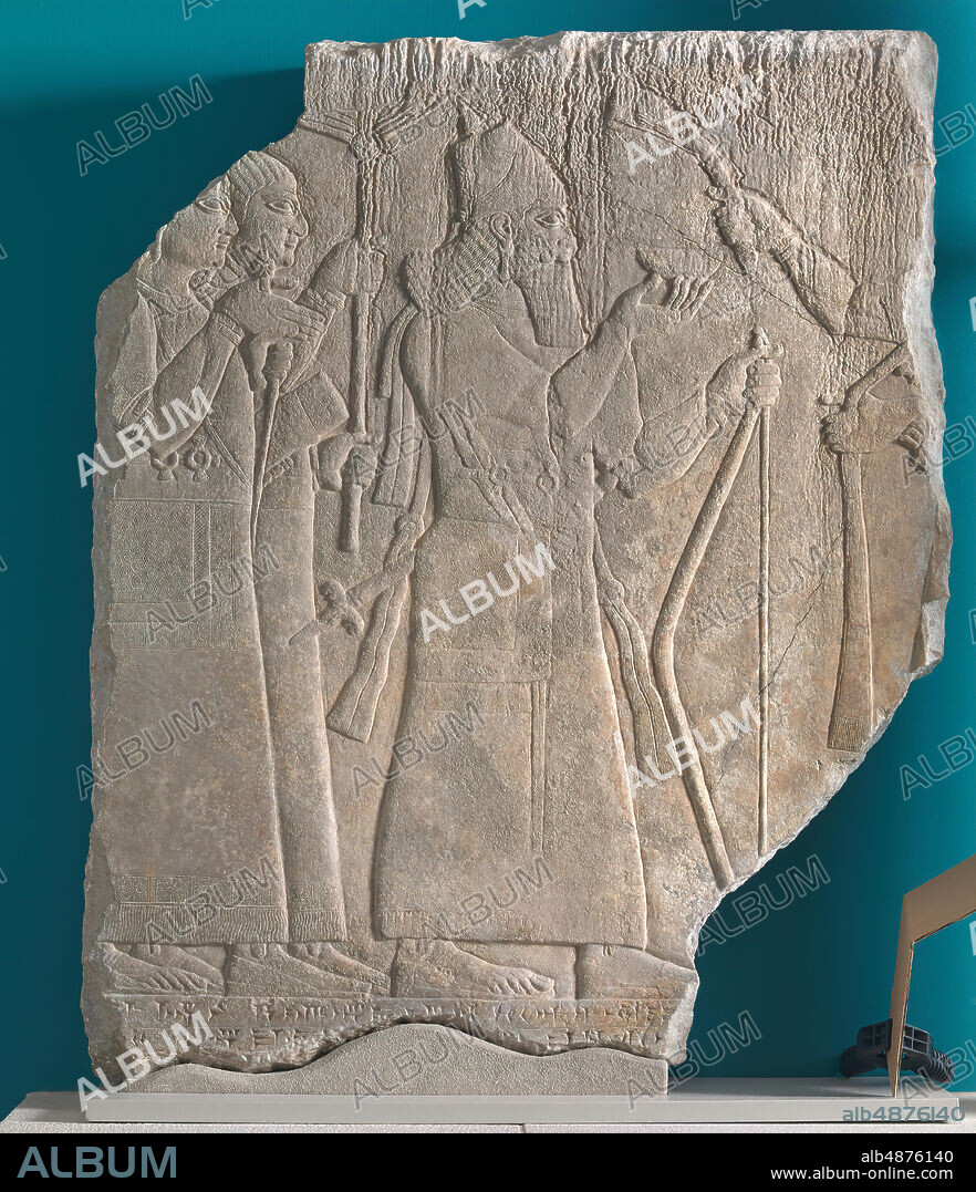 Unknown Artist, Assyrian Relief: Ashurnasirpal with Attendants Celebrating a Hunt from Kalhu (Nimrud), Iraq, Northwest Palace, West Wing, panel 16, ca. 875-860 B.C.E., gypsum (Mosul alabaster), 35 7/8 in. x 28 7/8 in. x 6 1/2 in. (91.2 cm. x 73.3 cm. x 16.5 cm.), This fragment shows Ashurnasirpal and his attendants pouring a libation to the gods in thanks for a successful hunt. The king, the central figure in this fragment, holds a bow in his left hand and a libation dish in his right, and he is followed by two beardless attendants who are understood to be eunuchs. One holds a parasol to shade the king while the other carries a bow and quiver. All three figures are equipped with wide belts with rings that attached to the hunting chariot and aprons that protected the hunters against chafing. The arm that extends into the scene from the right holds a flywhisk and would have belonged to the figure of another attendant.