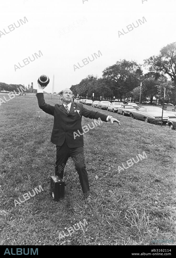 Washington, D.C.: September 8, 1974. Soyuz Commander and Russian cosmonaut Alexei Leonov throws a football pass on the Capitol Mall.