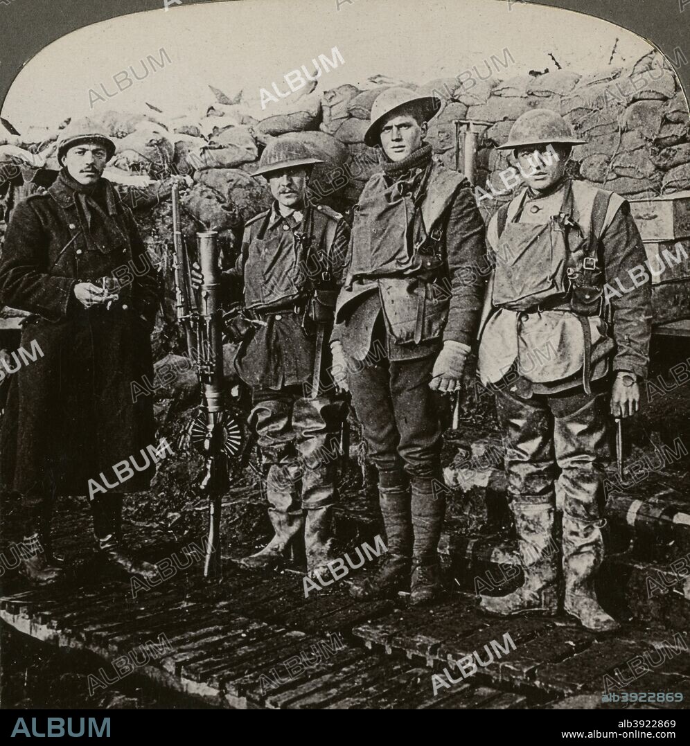 Lewis machine gunners, Hollebeke, Belgium, World War I, 1914-1918. A Belgian soldier poses with three British Tommies at the junction of the Belgian and British lines. Stereoscopic card detail.