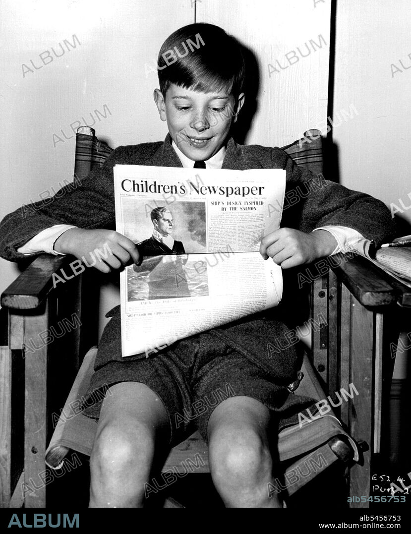 Reading the "Children's Newspaper" on the set of the Associated British-Marble Arch production "The Yellow Balloon", is 13-year-old boy star, Andrew Ray. The film was produced by Victor Skutezky and directed by J. Lee Thompson. September 30, 1952.
