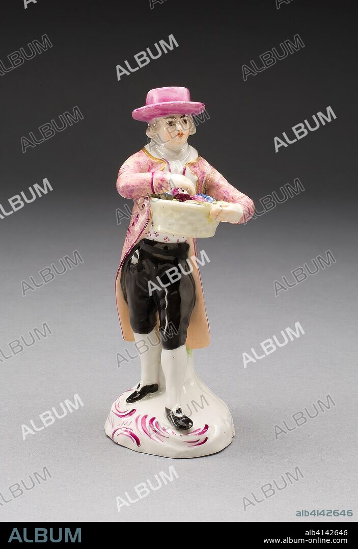 Figurine: Man with Grapes. Limbach Porcelain Factory; German, 1772-1944. Date: 1785-1795. Dimensions: 13.8 x 5.3 cm (5 7/16 x 2 1/4 in.). Soft-paste porcelain with polychrome enamel decoration and gilding. Origin: Limbach-Oberfrohna.