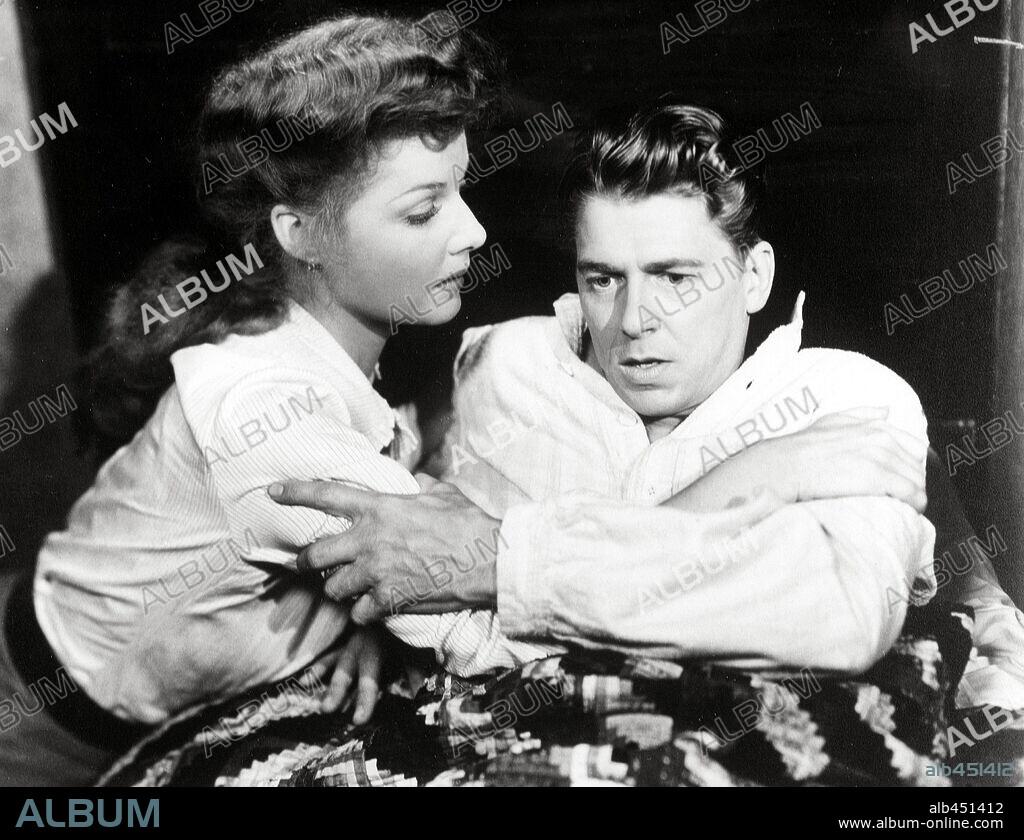 ANN SHERIDAN and RONALD REAGAN in KINGS ROW, 1942, directed by SAM WOOD. Copyright WARNER BROTHERS.