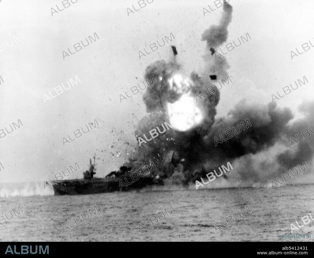Explosion on USS St. Lo (CVE-63) after she was hit by a kamikaze. The Battle of Leyte Gulf is considered to have been the largest naval battle of WWII and a contender for the title largest naval battle in history, with over 200,000 naval personnel involved. USS St. Lo (AVG/ACV/CVE-63) was a Casablanca-class escort carrier of the United States Navy during WWII. On October 25, 1944, St. Lo became the first major warship to sink as the result of a kamikaze attack. (cropped and cleaned).