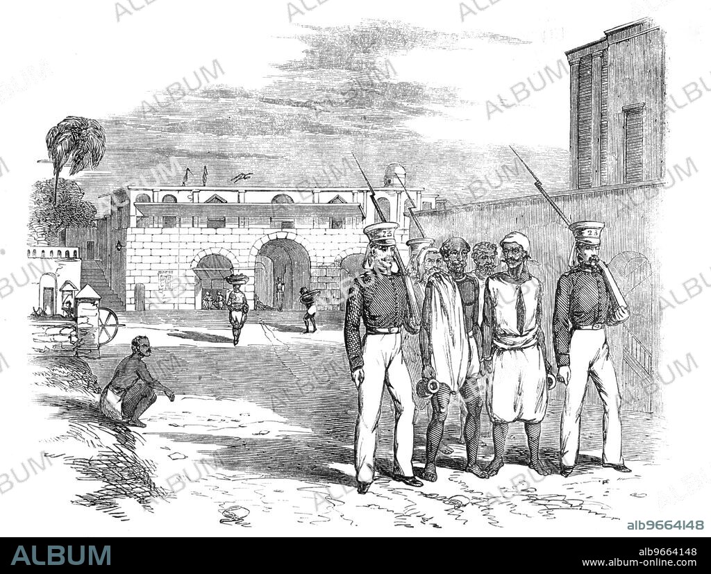 Calcutta Gate and Main Guard, Fort William, [Kolkata, India]: Native Prisoners under Escort, 1857. '...a native was tried for attempting to seduce the sepoys of the 70th Native Infantry in Calcutta from their allegiance, by holding out to them promises of arms, ammunition, and aid from 18,000 of the native population...Many of the prisoners taken are priests among their people: if Mahometans, they are moulvies or hafiz; and, if Hindoos, they are Brahmins. The latter are distinguished by a slight thread which they wear round the neck, and sometimes hung over an ear...'. From "Illustrated London News", 1857.