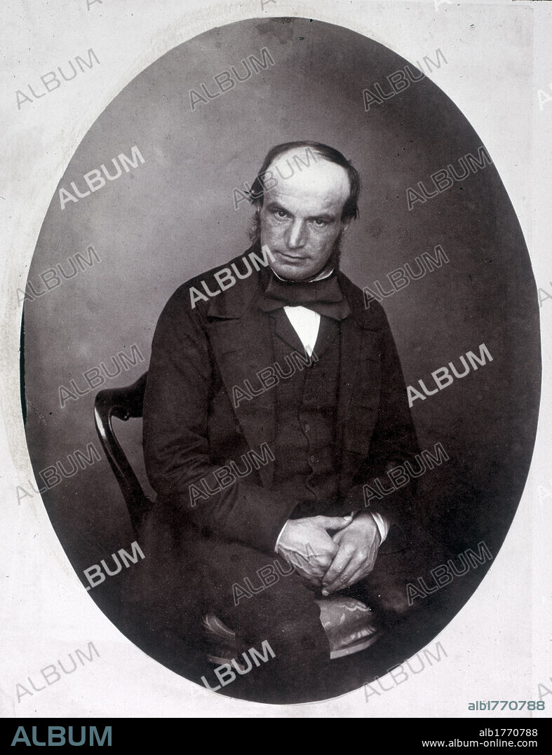 Portrait of John Couch Adams. Portrait of the English astronomer and mathematician John Couch Adams sitting with his hands in his lap. 1870s.
