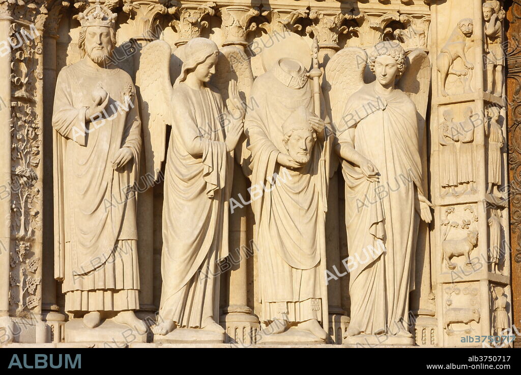 Statues including the Emperor Constantine and St. Denis carrying his head, Virgin's Gate, west front, Notre Dame Cathedral, UNESCO World Heritage Site, Paris, France, Europe.