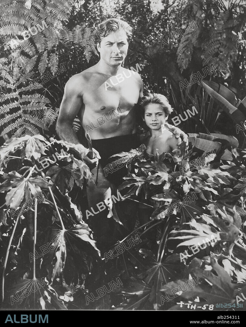 LEX BARKER y TOMMY CARLTON en TARZÁN, FURIA SALVAJE, 1952 (TARZAN'S SAVAGE FURY), dirigida por CY ENDFIELD. Copyright RKO.
