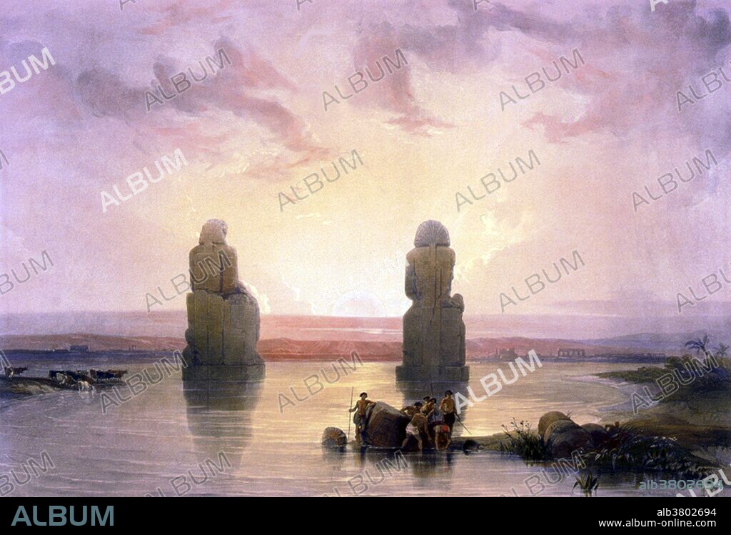 Entitled: "Statues of Memnon at Thebes, during the inundation." The Colossi of Memnon are two massive stone statues of Pharaoh Amenhotep III. His reign was a period of unprecedented prosperity and artistic splendor, when Egypt reached the peak of her artistic and international power. For the past 3400 years (since 1350 BC) they have stood in the Theban necropolis. The Valley of the Kings is a valley in Egypt where, for a period of nearly 500 years from the 16th to 11th century BC, tombs were constructed for the Pharaohs and powerful nobles of the New Kingdom (the Eighteenth to the Twentieth Dynasties of Ancient Egypt). The valley stands on the west bank of the Nile, opposite Thebes (modern Luxor), within the heart of the Theban Necropolis. The royal tombs are decorated with scenes from Egyptian mythology and give clues to the beliefs and funerary rituals of the period. Almost all of the tombs seem to have been opened and robbed in antiquity, but they still give an idea of the opulence and power of the Pharaohs. This area has been a focus of archaeological and egyptological exploration since the end of the eighteenth century, and its tombs and burials continue to stimulate research and interest. In 1979, it became a World Heritage Site, along with the rest of the Theban Necropolis. David Roberts was a Scottish painter known for a series of detailed lithograph prints of Egypt and the Near East that he produced from sketches he made during long tours of the region (1838-1840).