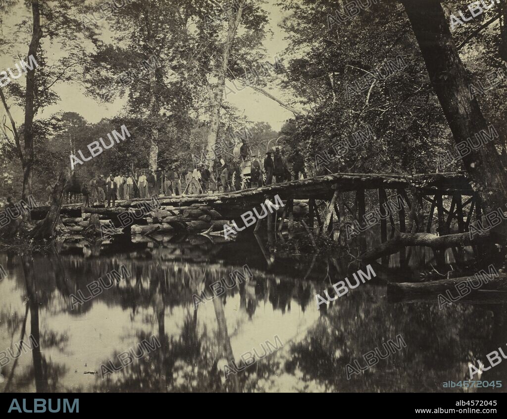 Military Bridge, Across the Chickahominy, Virginia, 1862. In this complex composition, David B. Woodbury merged the documentation of an event with his desire to record an impressive landscape. The image depicts a precarious, yet essential military log bridge that traverses a swamp created by the accumulated waters of the Chickahominy River, located southeast of Richmond, Virginia. Constructed under difficult physical conditions, the structure was later destroyed by floodwaters caused by heavy rains. The workers involved with the structure's construction are positioned in a single line so that each person is identifiable; however, reduced to diminutive size by the camera's distant viewpoint, the workers appear to be dominated by their natural environment. This image appeared in the first volume of a two-volume set of 100 Civil War photographs published between 1865-66 by Alexander Gardner (1821-1882), who printed the negatives and compiled the album, which included work by a number of other photographers.