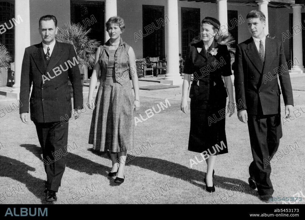 The Prime Minister Of South Africa "At Home" -- Mr. J.G. Strijdom, the new Prime Minister of South Africa, photographed with his wife (3rd from left) and their two children - Miss Estelle Strijdom and Mr. Gerhardus Strijdom, walking in the grounds of "Groote Schuur", the official residence of South African Prime Ministers in Cape Town. January 05, 1955. (Photo by Sport & General Press Agency, Limited).
