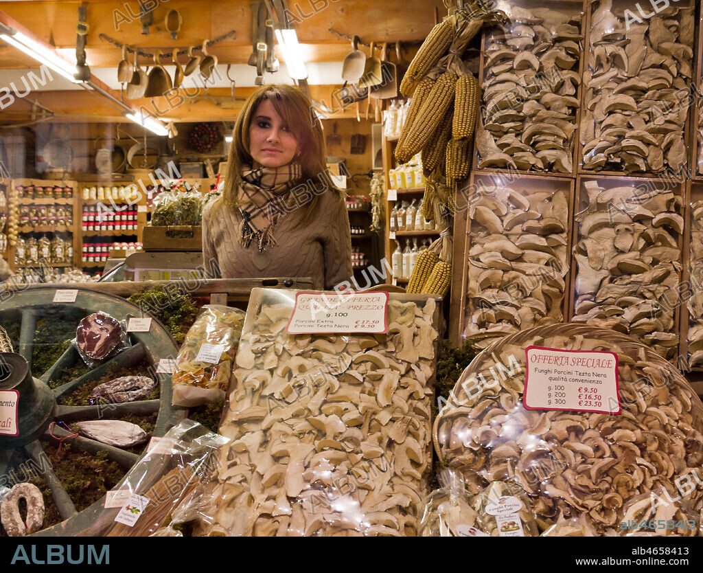 Bormio, "La Sceleira" shop: Veronica Pozzi (the owner's daughter) behind packages of dried mushrooms.
