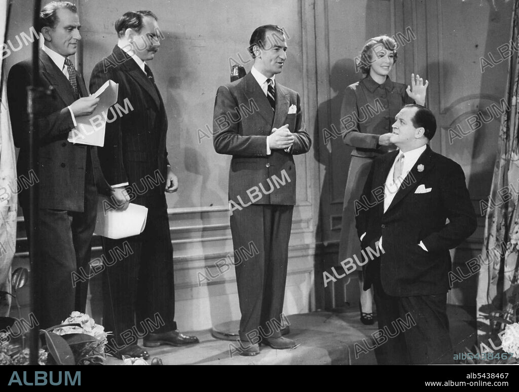 'Take it From Here' is Static. B.B.C. commentator Richard Dimbleby is puzzled to find the real Dick Bentley among the wax models of the 'Take It From Here' starts in the Tussaud Exhibition at Baker Street, W. For others in a like plight - Bentley is posing second from right. The models of Bentley, 'Professor' Jimmy Edwards and Joy Nichols have been added to the Tussaud collection on the centenary of the death of the founder, Madame Tussaud. Bentley went along to unveil them a ceremony that was t.