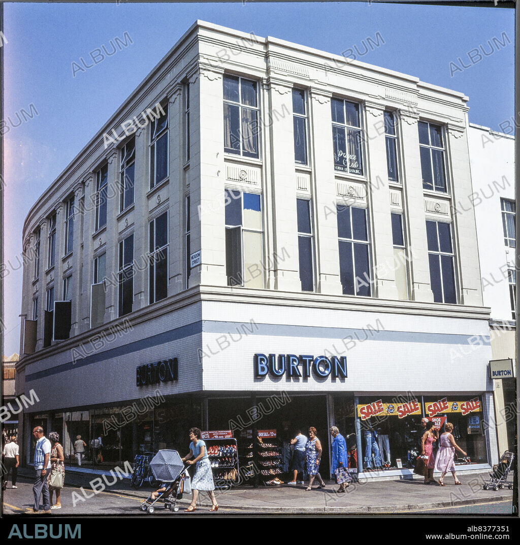 NICHOLAS ANTHONY JOHN PHILPOT. Burton, 159-161 Commercial Road, Portsmouth, City of Portsmouth, 1970s-1980s. The Burton store on the corner of Commercial Road and Meadow Street, seen from the south before construction of the Cascades Shopping Centre. Meadow Street was redeveloped as part of the Cascades Shopping Centre, probably in the late 1980s. The Burton store at 159-161 Commercial Road remained, although many of the windows on the Meadow Street facade were blocked up.