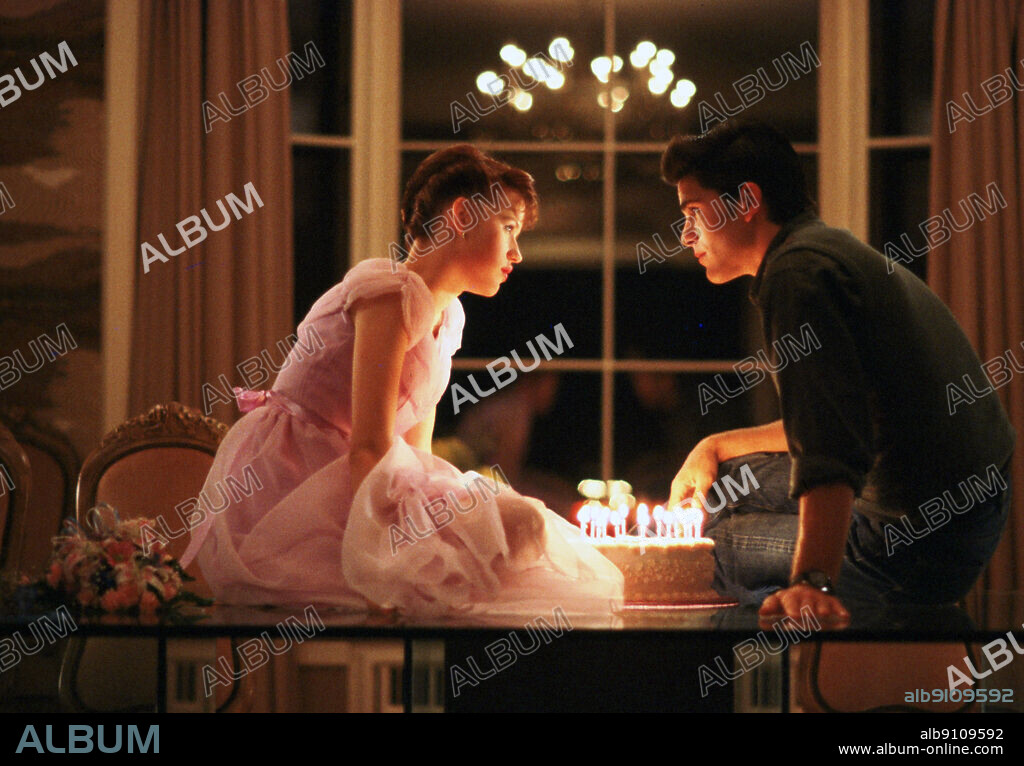 MICHAEL SCHOEFFLING and MOLLY RINGWALD in SIXTEEN CANDLES, 1984, directed by JOHN HUGHES. Copyright UNIVERSAL PICTURES.