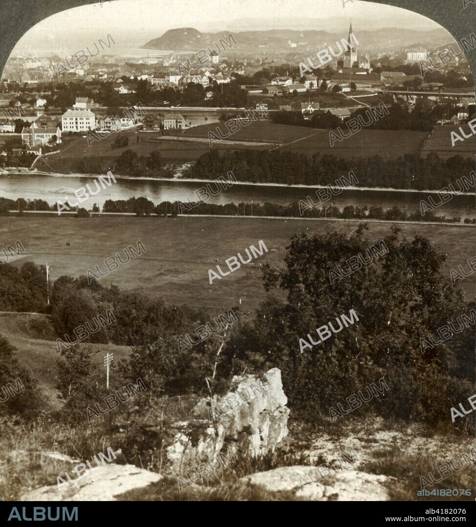 'Trondhjem, its homes, warehouses and cathedral, between river Nid and Fjord, Norway', 1905. From "The Underwood Travel Library - Norway". [Underwood & Underwood, London, 1905].