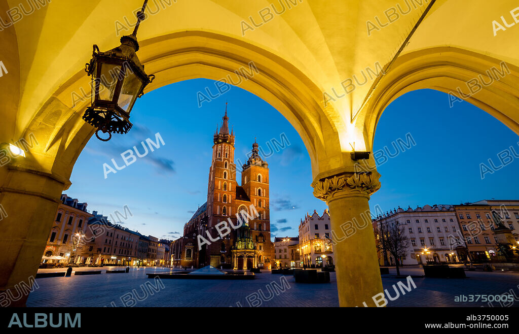 St. Mary's Church (St. Marys Basilica) and main square illuminated at dawn, UNESCO World Heritage Site, Krakow, Poland, Europe.