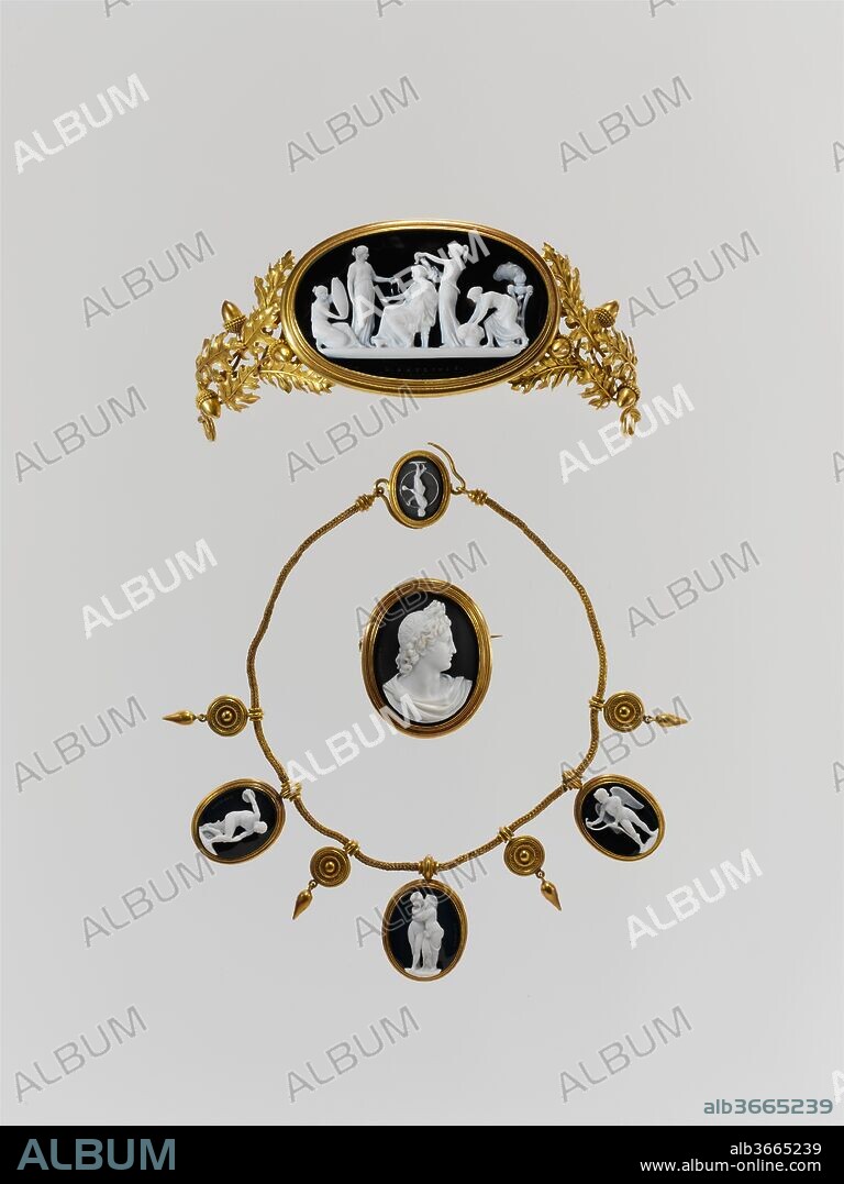 Parure: tiara, necklace, and brooch. Artist: Cameos carved by Luigi Saulini (Italian, 1819-1883). Culture: Italian, Rome. Designer: Designer of Diadem (a) John Gibson (British, Gwynedd, Wales 1790-1866 Rome). Dimensions: Diadem, visible cameo: 1 13/16 x 3 1/16 in. (4.7 x 7.8 cm); 46.8 x 78 mm; Diadem, overall with setting: 2 1/4 x 5 5/8 in.; Brooch, visible cameo: 1 11/16 x 1 5/16 in. (4.3 x 3.3 cm); 42.6 x 33.4 mm; Brooch, overall with setting: 2 1/16 x 1 11/16 in.; Necklace: visible cameo at clasp: 20.2 x 14.6 mm; visible cameo at PL: 26.7 x 20.9 mm; visible cameo at center: 29 x 23.1 mm; visible cameo at  PR: 27.2 x 20.7 mm. Date: mid-19th century.
Luigi Saulini learned hardstone and shell carving from his adopted father, Tommaso (1784-1864), and continued in the family trade from a successful shop in the Via del Babuino in Rome.
Cameo-laden parures that included tiaras became fashionable among Napoleon's sisters and the ladies of his court. The taste survived for at least a half century. A bit of paper that accompanied the set when Weil lent it to the Metropolitan Museum in 1929 stated that the mounts were designed by John Gibson (1790-1866), a British sculptor resident in Rome, and executed by Castellani, the Roman firm of goldsmiths. Saulini's studio was near Gibson's, and many artists turned to Castellani for mounts in the best "archaeological" style. Certainly an able hand modeled the tiara's acorns and oak leaves and the firm is not to be ruled out, but the leaves are pointier than in other oak jewelry known to be by Castellani.
The large stone in the tiara, despite the tradition probably not designed by Gibson, represents the toilet of Nausicaa, a rare subject even in ancient art. To ensure that Nausicaa, wise and beautiful daughter of King Alcinous of Phaeacia, would rescue the shipwrecked and travel-stained Ulysses as he slept in a bed of leaves at the mouth of the river Calliroe, Minerva directed her in a dream to go with her handmaids to the river to wash her family's linens. Here, though, her companions lavish their attention on the princess, fixing her hair, bringing her jewelry, and reflecting her beauty in a mirror. All but one of the other cameos copy ancient marbles. The bust in the brooch is of the Vatican's Apollo Belvedere. The three large stones in the necklace cite the statues Discobolus, Cupid and Psyche, and Cupid Stringing His Bow, the first in the Museo Nazionale in Rome, the last two in the Musei Capitolini. The unsigned nude youth with a hoop and a paddle on the clasp is after a long-lost ancient intaglio Johann Joachim Winckelmann singled out in his Thoughts on the Imitation of Greek Works in Painting and Sculpture, published in 1755. Its design survives in copies by Giovanni Pichler and others.
