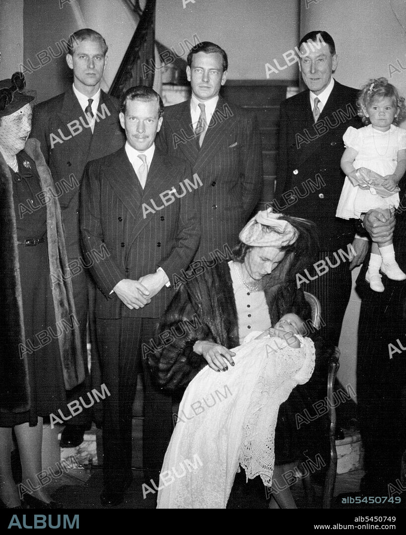 Lt. Mountbatten God-Parent At Christening
Picture at Lt. -Col. Philips' home in Grosvenor-square, London, today, following the christening ceremony are (left to right standing) Lady Zia Wernher, Lieut. Philip Mountbatten, Major D. Butters the Marquess of Milford Haven Colonel, H. Phillips, grand-father of the baby, and Sacha, daughter of Lt. -Col. and Mrs. Harold Phillips Mrs. Harold Phillips with her son Harold Nicholas, is seated in centre.
Lieut. Philips Mountbatten R.N., and his fubure best-man the Marquess of Milford Haven, were god-parents at the christening ceremony of Harold Nicholas, babys son of Lt. -Col. and Mrs Harold Phillips hold at St. Margaret's Westminster, today (Friday). Mrs. Phillips was formely Miss Georgina Wernher, elder daughter, elder daughter of Sir Harold and Lady Zia Wernher. The Couple were married in October, 1944, and have another daughter, Sacha. October 17, 1947.