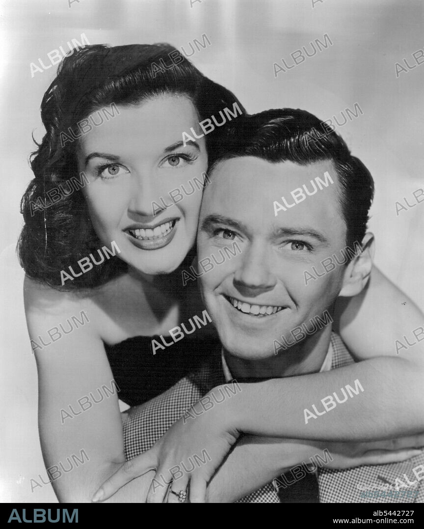Peggy Ryan and Ray McDonald. She's film-star Peggy Ryan, the only girl with eight-man Ray show scheduled to move Sydney Stadium audiences to sobs. But Peggy was really chosen because she foils Johnny Ray  her bright face looks as though it's laughing even when she's deep in the glycerine chokers. Where Johnny screws up his face into the most agonising contortions unimaginable when he sings, Peggy accompanies her numbers with pert little expressions of gaiety. She is one of the few comedians left who make their audiences laugh by daring to laugh themselves. When Peggy bounces on to Sydney Airport on September 5 she'll jump right into her new Sydney Stump song-and-dance act with husband Ray McDonald. August 26, 1954.