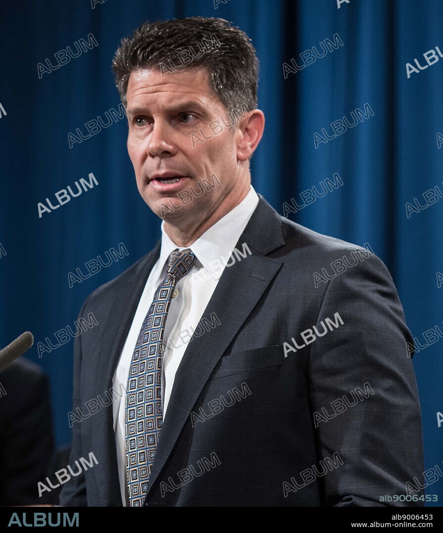 Photograph of David Bowdich at the Hacking Scheme press conference. David Lance Bowdich (1969-) Deputy Director of the FBI.