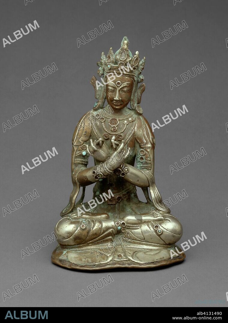 Vajradhara Buddha Seated Holding a Thunderbolt (Vajra) and Bell (Ghanta). Tibet; Southern Tibet. Date: 1401-1500. Dimensions: 16.5 x 10 x 7.6 cm (6 1/2 x 3 15/16 x 3 in.). Silver and semiprecious stones. Origin: Southern Tibet.