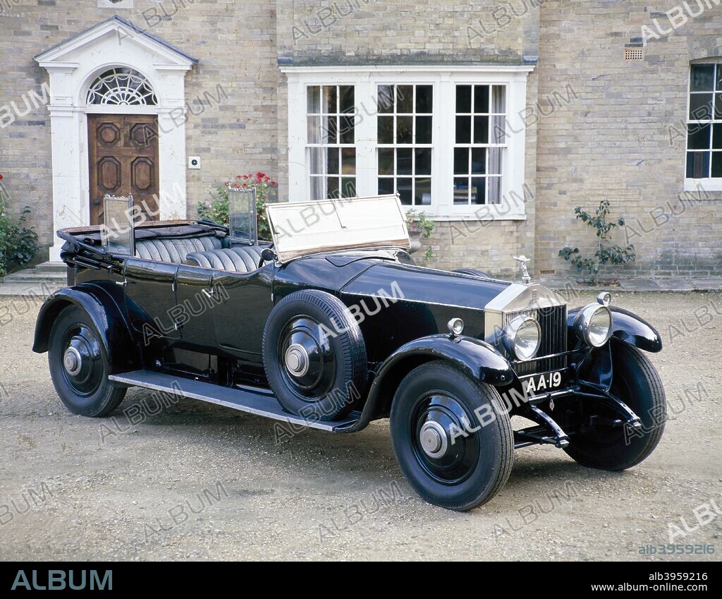 A 1925 Rolls-Royce Phantom I. The Phantom I was a successor to the Silver Ghost. This example was bought in 1925 by Lord Montagu's father and was used by him until his death in 1929. It was delivered new with bodywork by Hooper & Co. (Coachbuilders) Ltd. During the Second World War it was fitted with a mobile canteen body and saw service with the NAAFI (Navy, Army and Air Force Institutes). Later, it was used to tow gang mowers around playing fields in Somerset, before being stored in a dilapidated state on a farmyard. The car was bought by the present Lord Montagu, and reconstructed for the National Motor Museum by Leslie Willis.