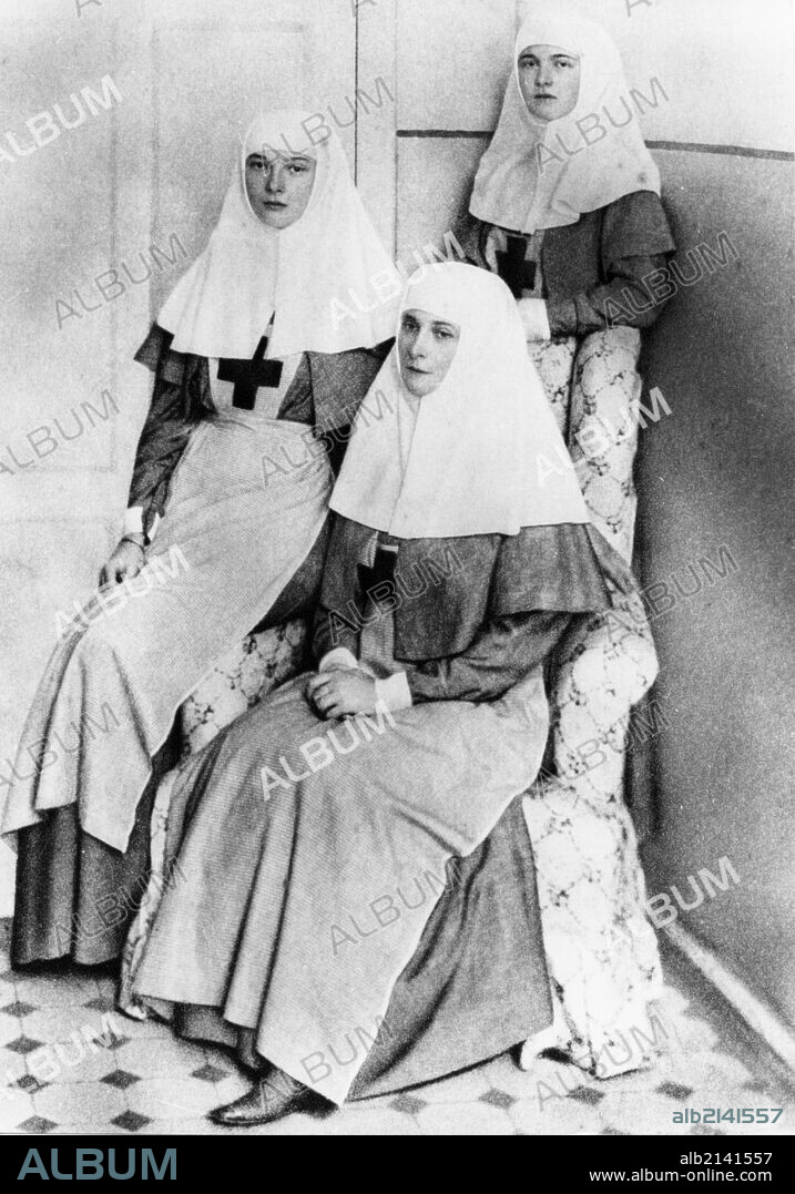 Empress alexandra and her daughters olga and tatiana after finishing the complete nursing course and receiving diplomas from the international red cross, 1914. 01/02/1914